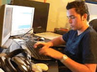 Man Doing Search by Social Security Number on His Computer